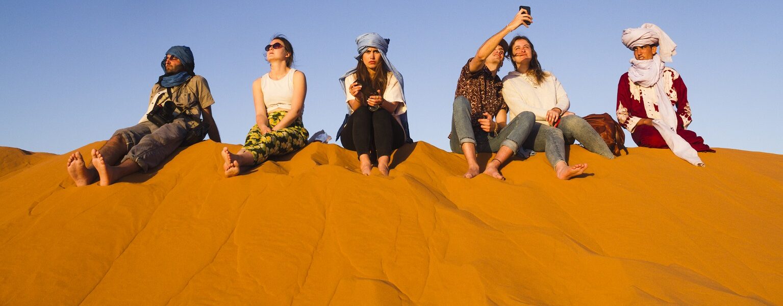 poeple on sand dune