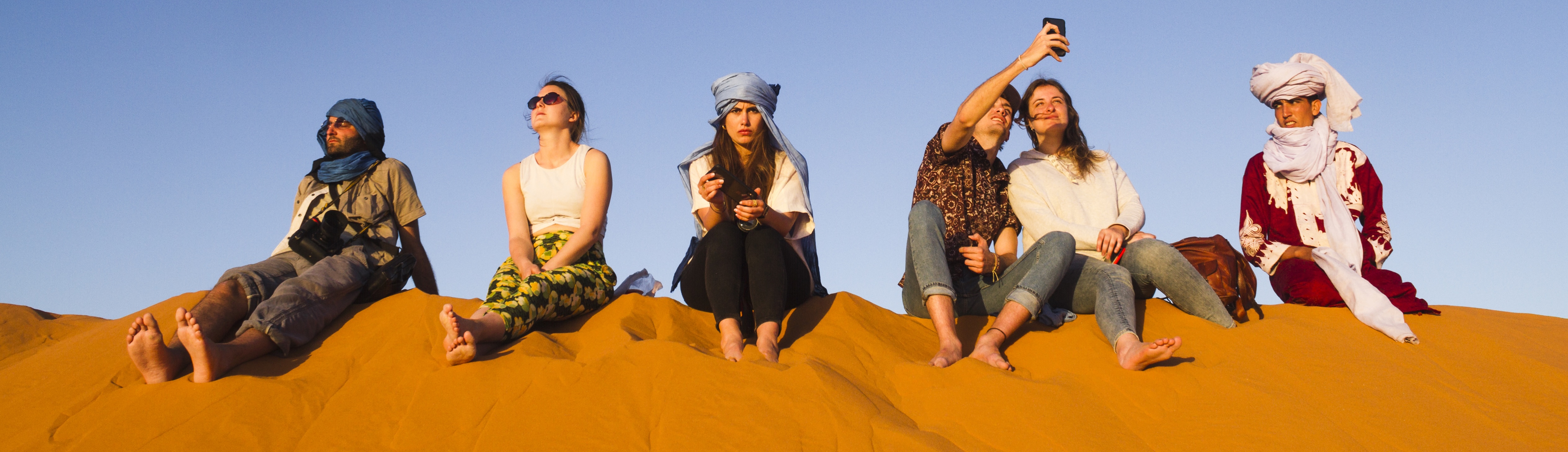 poeple on sand dune