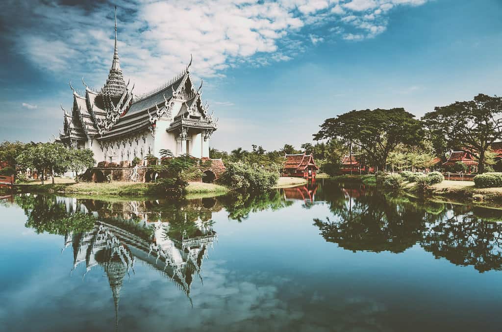 Traveler using phone on beach