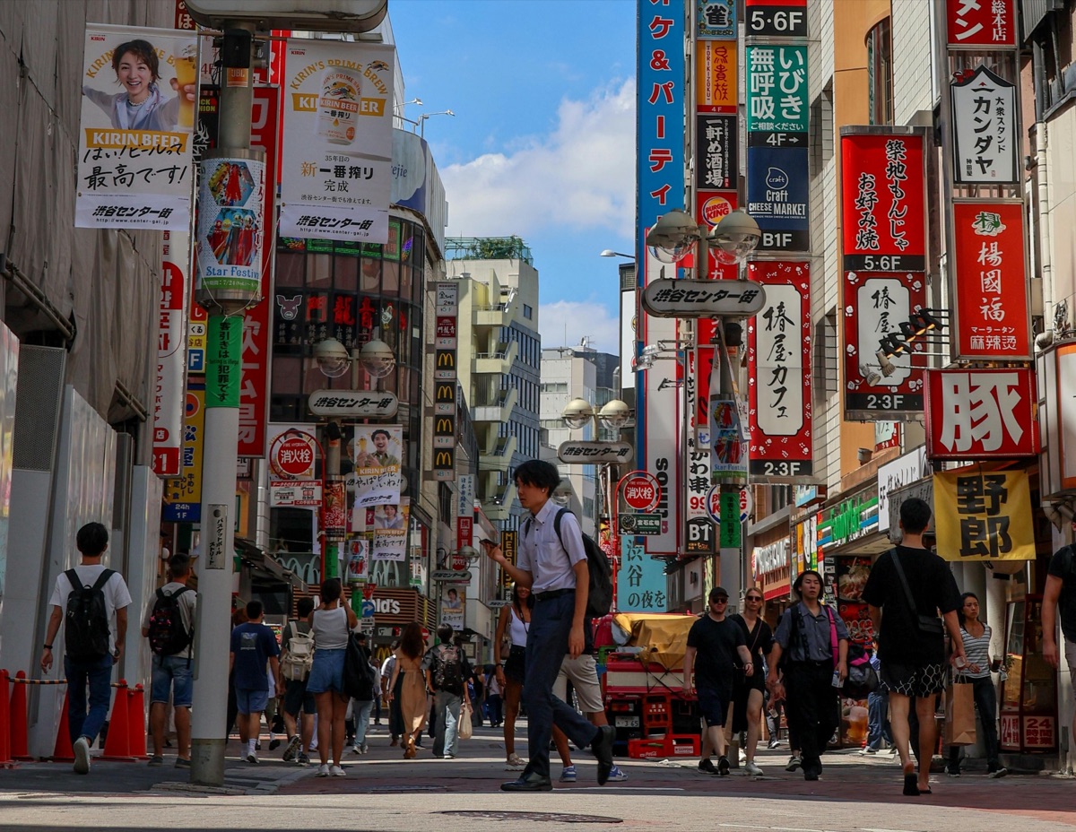 Traveler using phone on beach